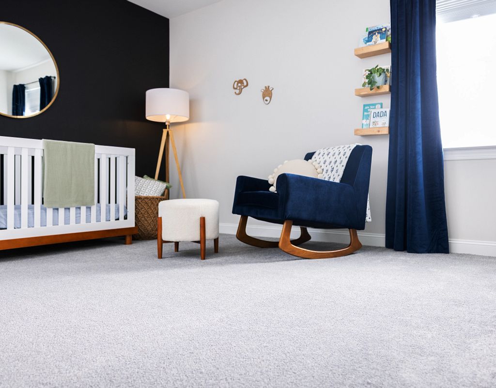 Carpet flooring with blue sofa | Direct Carpet Unlimited