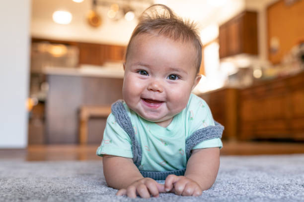 Baby laying on carpet flooring | Direct Carpet Unlimited