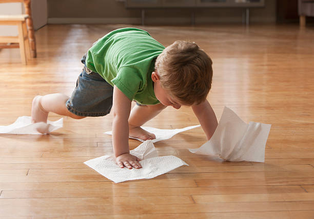 Kid cleaning floor | Direct Carpet Unlimited